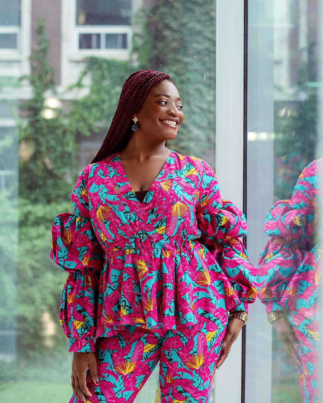 Yvonne Ben in pink and teal print outfit