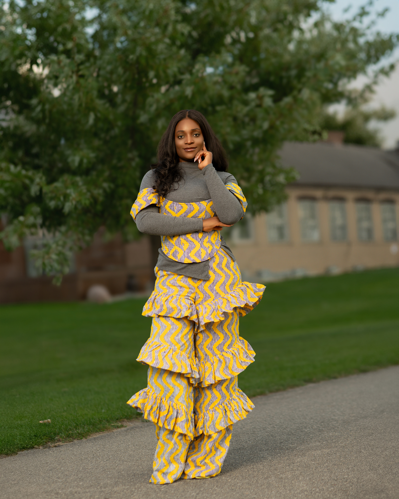 Yvonne Ben in yellow tiered ruffle outfit